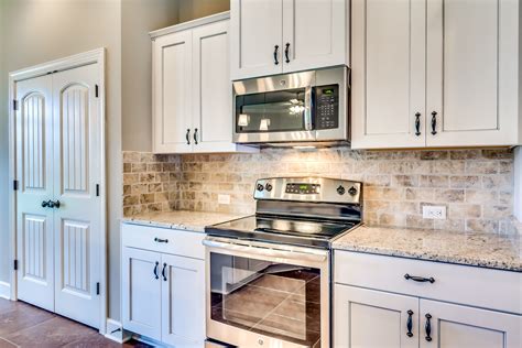 white kitchen cabinets with stainless steel countertops|white cabinets with marble countertops.